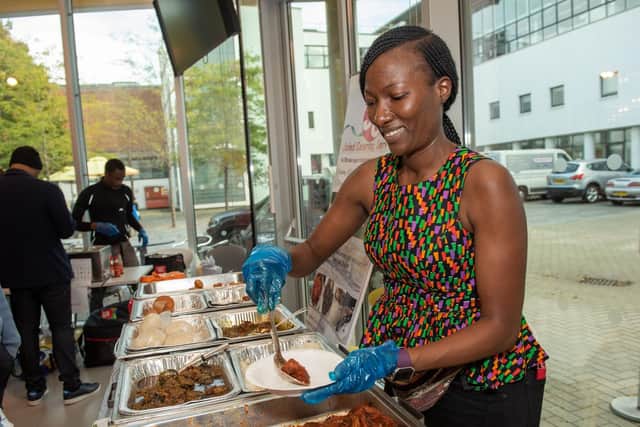 Ore Olayemi serving food from Joled Catering Service at the African-Caribbean Fusion Festival at the University of Portsmouth's Eldon building. Picture: Vernon Nash (051019-008)