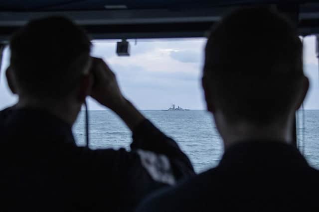 Pictured: Royal Navy Offshore Patrol Vessel HMS Mersey shadows Russion warship Yaroslav Mudryy.