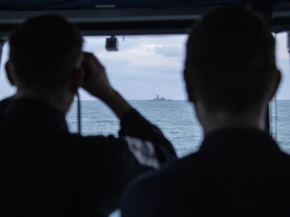 Pictured: Royal Navy Offshore Patrol Vessel HMS Mersey shadows Russion warship Yaroslav Mudryy.