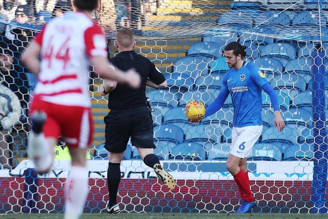 Christian Burgess kicks the ball away following his mistake that led to Mallik Wilks scoring for Doncaster against Pompey last season. Picture: Joe Pepler
