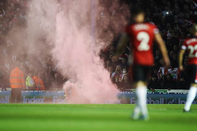 A flare at Fratton Park when Pompey played Southampton in the third round of the Carabao Cup on September 24. Picture: Joe Pepler