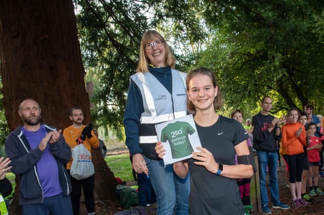 Havant Parkrun at Staunton Country Park. Rachel Muckelt completed her 250th parkrun. Her achievement was celebrated by run director Bridget Main and everyone else at Saturday's event. Picture: Vernon Nash (051019-008)