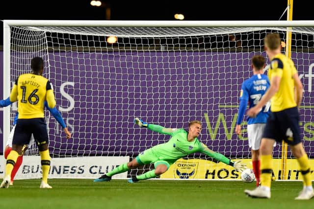 Alex Bass is beaten by Matty Taylor's strike