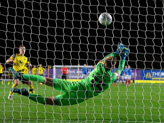 Alex Bass superbly saves from Josh Ruffels during an impressive night against Oxford United for the young keeper. Picture: Graham Hunt/ProSportsImages