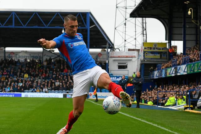 Lee Brown stretches to keep the ball in play