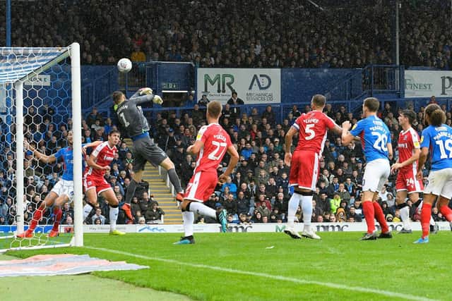 Gillingham goalkeeper Jack Bonham knocks the ball out of play