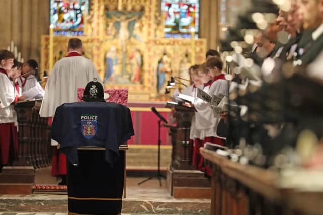 The helmet of PC Andrew Harper rests on his coffin during his funeral service at Christ Church Cathedral in St Aldate's, Oxford. Picture: Steve Parsons/PA Wire