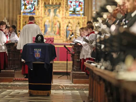 The helmet of PC Andrew Harper rests on his coffin during his funeral service at Christ Church Cathedral in St Aldate's, Oxford. Picture: Steve Parsons/PA Wire