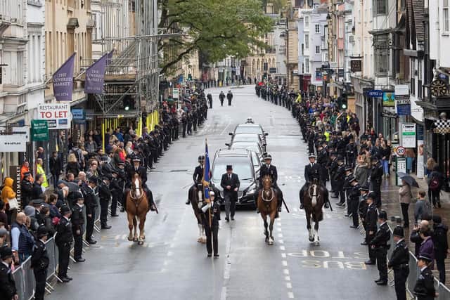 Members of the public line the High Street in Oxford to pay their respects as the funeral cortege for PC Andrew Harper. Picture: Aaron Chown/PA