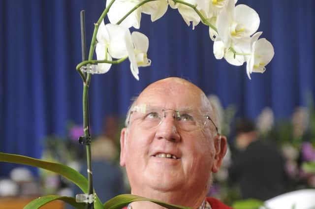 An exhibitor at the 2017 Wessex Orchid Society Show held at Portchester Community School.