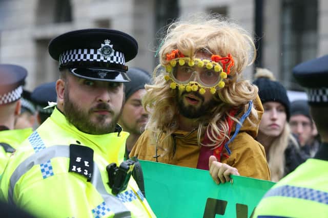 Protesters blocking the road in the City of London during an Extinction Rebellion climate change protest. PA Photo.
