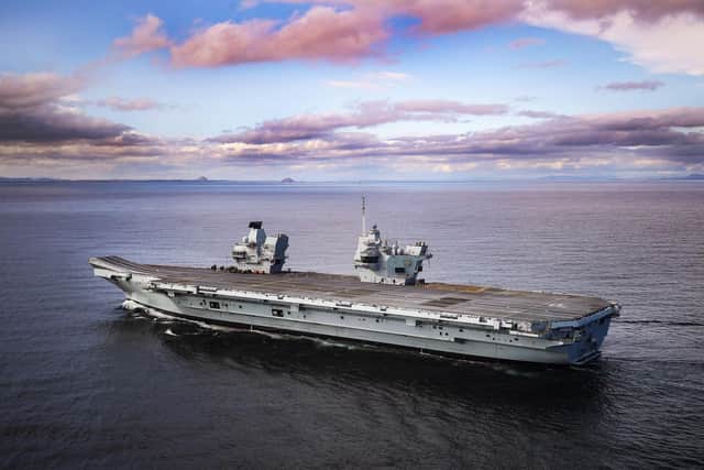 HMS Prince of Wales heading out to sea to tackle rough waters in the North Sea.