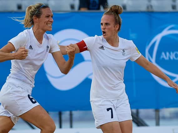 Wendy Martin, left, and Sarah Kempson celebrate a goal as GB hit back from 2-5 down to reach the World Beach Games Beach Soccer final