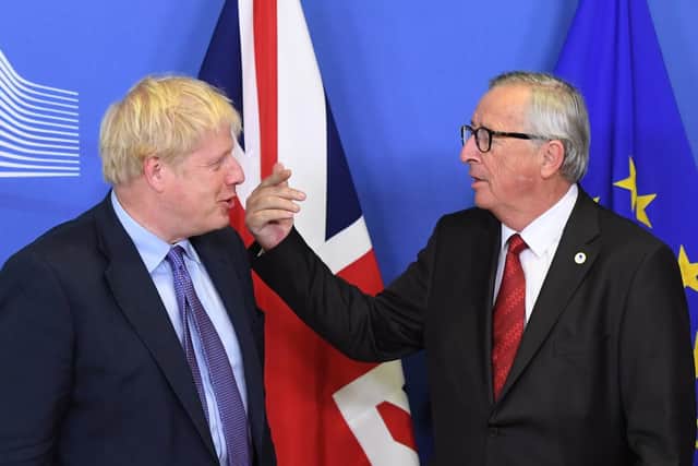UK Prime Minister Boris Johnson and Jean-Claude Juncker, President of the European Commission, after a new Brexit deal was agreed. Picture: Stefan Rousseau/PA Wire