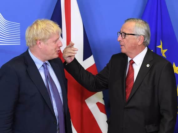 UK Prime Minister Boris Johnson and Jean-Claude Juncker, President of the European Commission, after a new Brexit deal was agreed. Picture: Stefan Rousseau/PA Wire