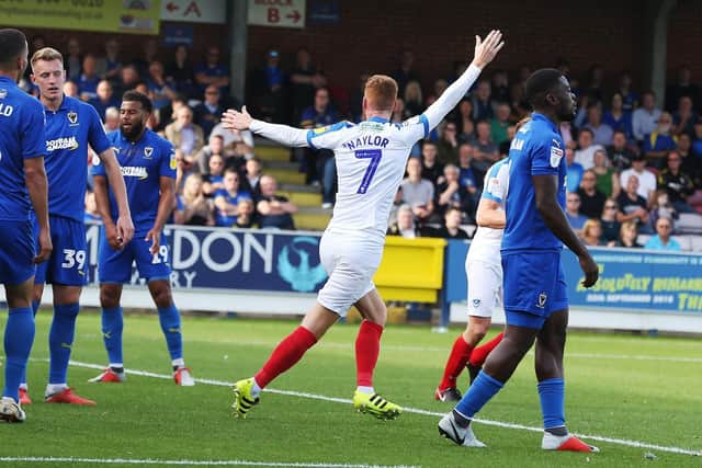 Tom Naylor celebrates his goal at AFC Wimbledon last season. Picture: Joe Pepler