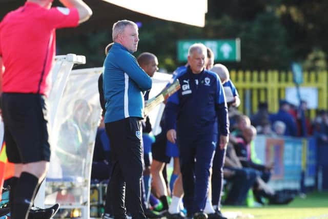 Kenny Jackett watches the action at Kingsmeadow / Picture: Joe Pepler