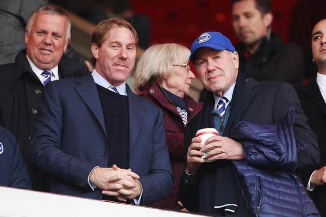 Pompey chairman Michael Eisner, right, with son Eric   Picture: Joe Pepler