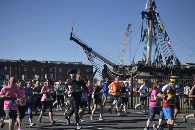 Participants in the Great South Run pass HMS Victory, in Portsmouth Historic Dockyard. Picture: Mary Turner