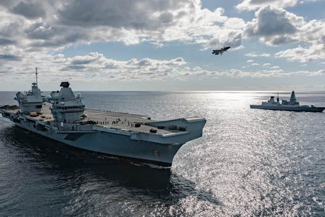 UK F-35 Lightning jets landing, taking off from HMS Queen Elizabeth with HMS Dragon in the background. Photo: Royal Navy