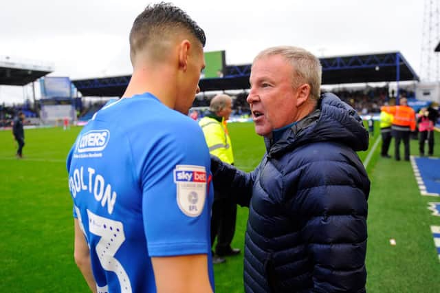 Pompey boss Kenny Jackett with Blues defender James Bolton