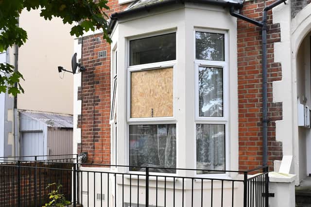 The window has been boarded up after the attack.
Picture: Malcolm Wells (191016-8496)