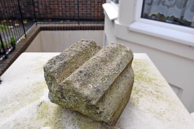 The piece of masonry launched through the window