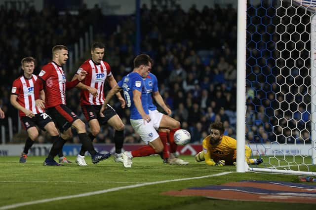 John Marquis pokes Pompey in front against Lincoln. Picture: Joe Pepler