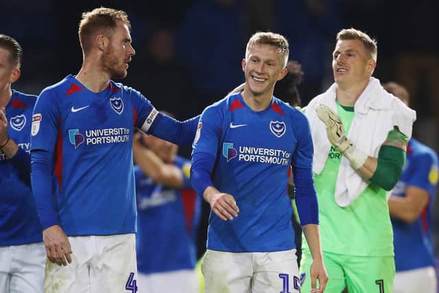 Ross McCrorie, centre, celebrates Pompey's win. Picture: Joe Pepler