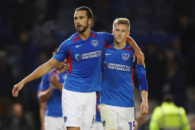 Christian Burgess and Ross McCrorie look pleased after Pompey's win against Lincoln