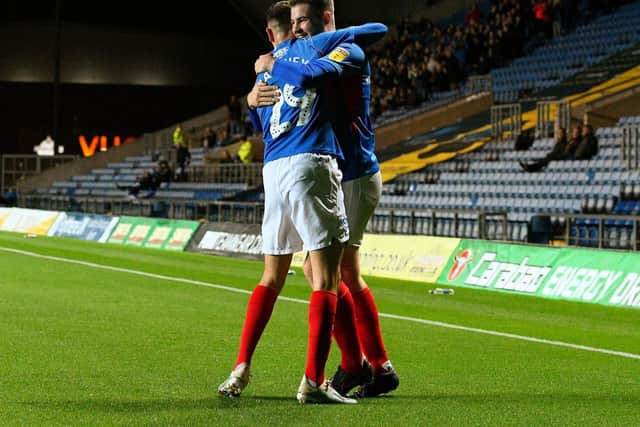Bradley Lethbridge, right, celebrates his goal at Oxford in the EFL Trophy with Leon Maloney. Picture: Joe Pepler