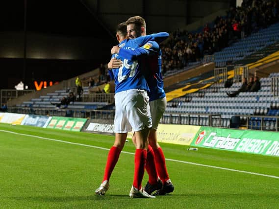 Bradley Lethbridge, right, celebrates his goal at Oxford in the EFL Trophy with Leon Maloney. Picture: Joe Pepler