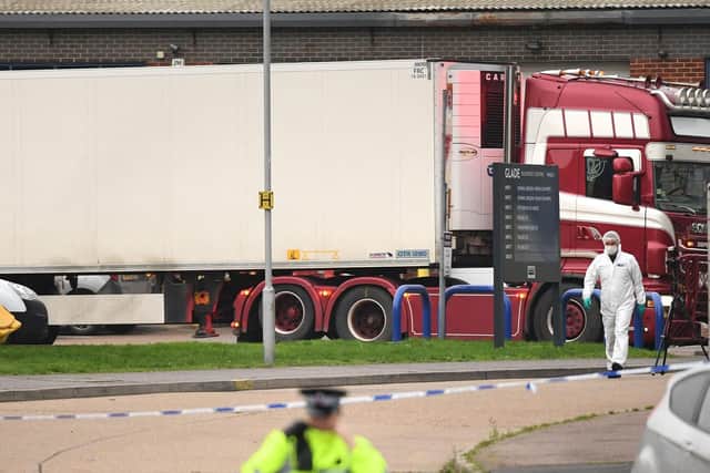 The container lorry where 39 people were found dead inside leaves. Picture: Stefan Rousseau/PA Wire