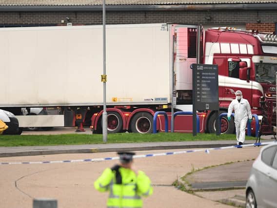 The container lorry where 39 people were found dead inside leaves. Picture: Stefan Rousseau/PA Wire