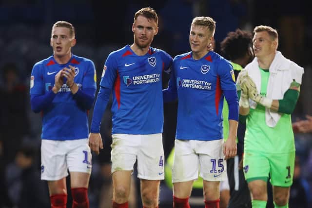 Ross McCrorie, right centre, was brought into the Pompey defensive line-up for the midweek win against Lincoln     Picture: Joe Pepler