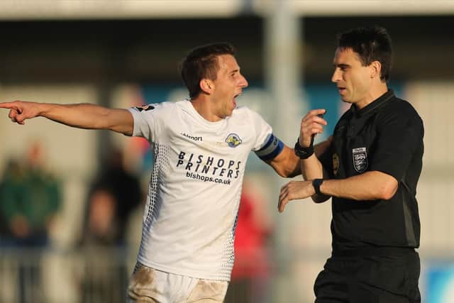 Wes Fogden has a word with referee Daniel Lamport during Hawks' FA Cup exit to Dulwich last weekend