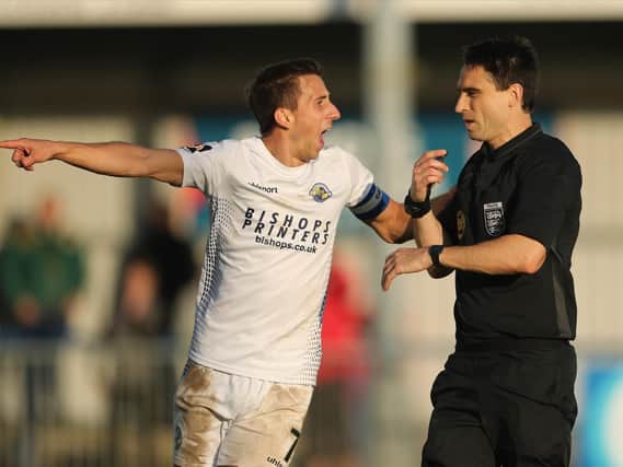 Wes Fogden has a word with referee Daniel Lamport during Hawks' FA Cup exit to Dulwich last weekend