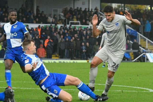 Scorer Gareth Evans is challenged in the draw at the Memorial Stadium  Picture: Graham Hunt