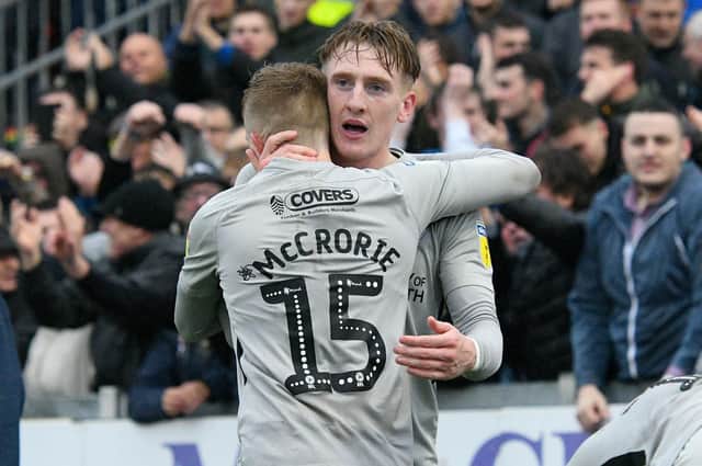 Ronan Curtis celebrates his goal with Ross McCrorie