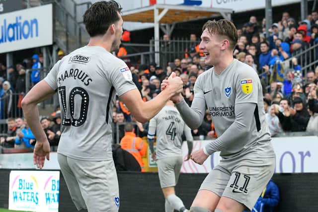 Ronan Curtis celebrates with John Marquis after their combination put Pompey 2-0 up at Bristol Rovers. Picture: Graham Hunt/ProSportsImages