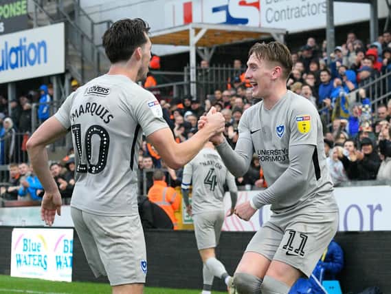 Ronan Curtis celebrates with John Marquis after their combination put Pompey 2-0 up at Bristol Rovers. Picture: Graham Hunt/ProSportsImages