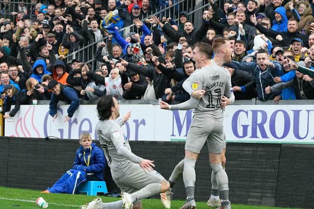 Ronan Curtis celebrates with Tom Naylor and Ryan Williams after netting Pompey's second in Saturday's 2-2 draw at Bristol Rovers. Picture: Graham Hunt/ProSportsImages