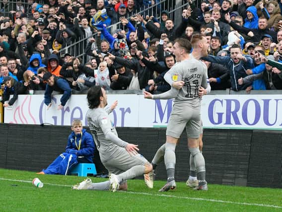 Ronan Curtis celebrates with Tom Naylor and Ryan Williams after netting Pompey's second in Saturday's 2-2 draw at Bristol Rovers. Picture: Graham Hunt/ProSportsImages