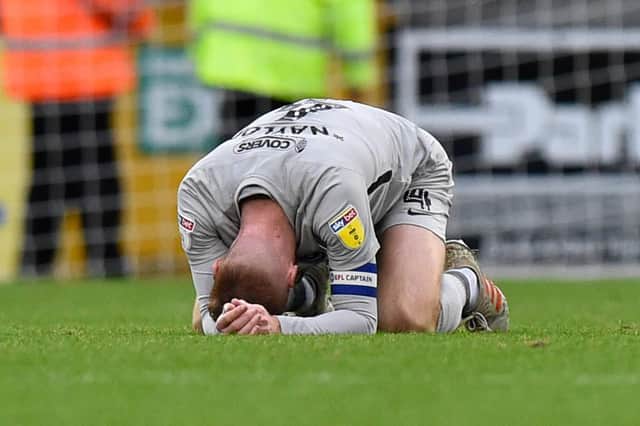 Skipper Tom Naylor is dejected after Pompey surrendered two points in stoppage time at Bristol Rovers on Saturday. Picture: Graham Hunt