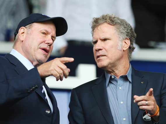 Pompey chairman Michael Eisner, seen here with Will Ferrell at Fratton Park in August, has given his backing to Kenny Jackett: Picture: Joe Pepler