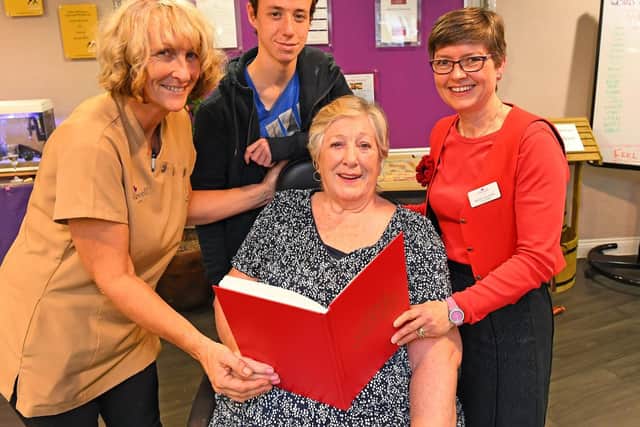 Ann Morton-Stewart (82) with (left to right) her daughter Jan Walker, grandson Lewis Walker (18) and Gracewell Volunteer Becky Falstein. Picture: Malcolm Wells (301019-9281)