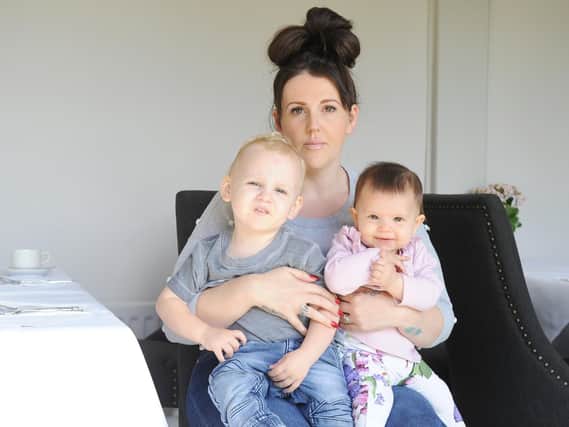 Jemma Spurr, 36, with two of her children. The family ended up spending several weeks living in a hotel after their home was damaged by a fire caused by a suspected faulty tumble dryer.
Picture : Habibur Rahman