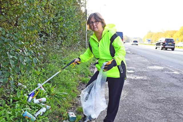 Lynda Davison is disgusted with the state of the lay-by on the approach to Fareham on the southbound A27 from Junction 11 of the M27 with beer cans, bottles of urine and human faeces on the roadside verge and hedgerow
Picture: Malcolm Wells (061119-9503)