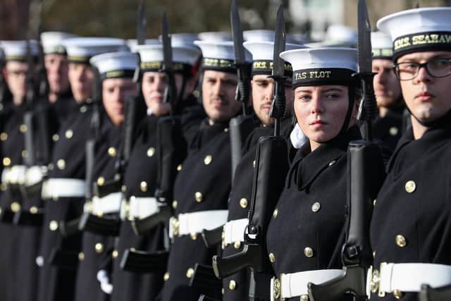 The sailors and marines stand to attention. Picture: LPhot Joe Cater