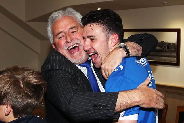 Enda Stevens and former Pompey chairman Iain McInnes celebrate League Two promotion at Notts County. Picture: Joe Pepler